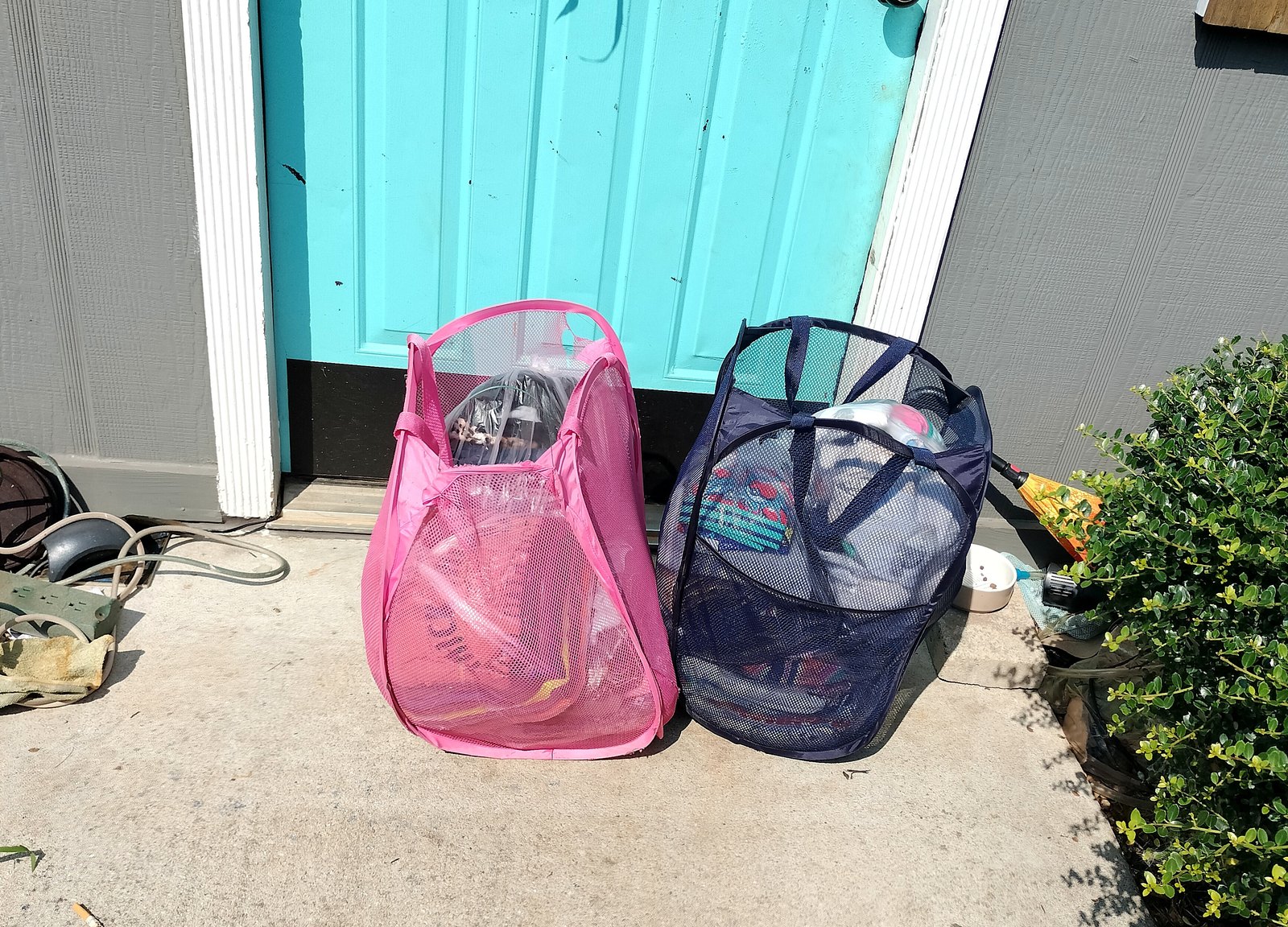 Laundry hampers and bags set out ready for collection
